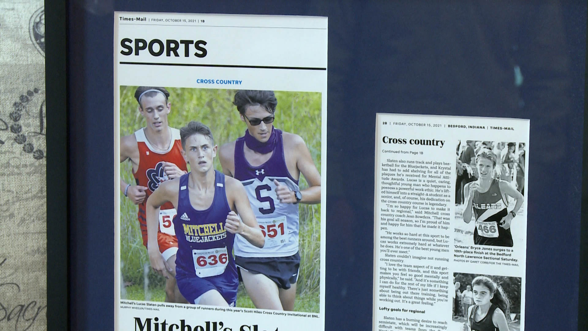 framed newspaper articles of track meets